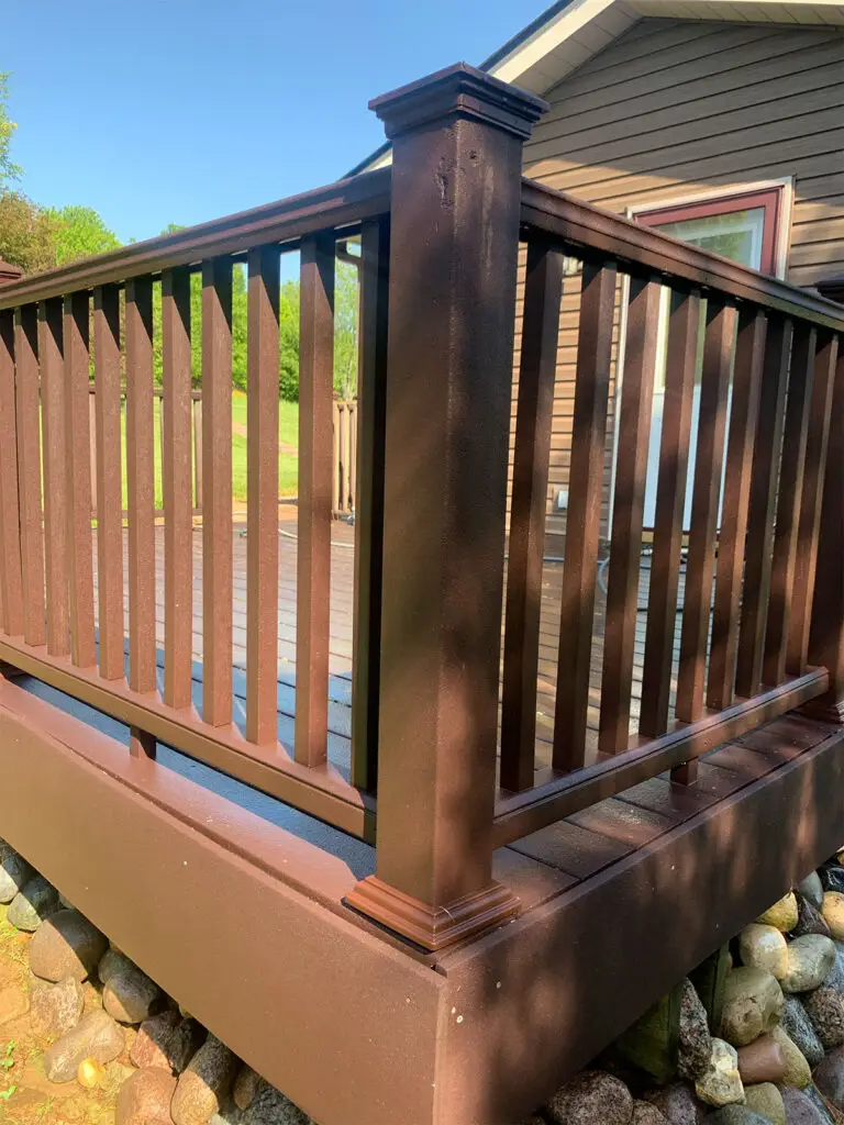 The Benefits of Professional Fence Washing Moldy fence post after cleaning - restored wood post by Liberty Power Wash