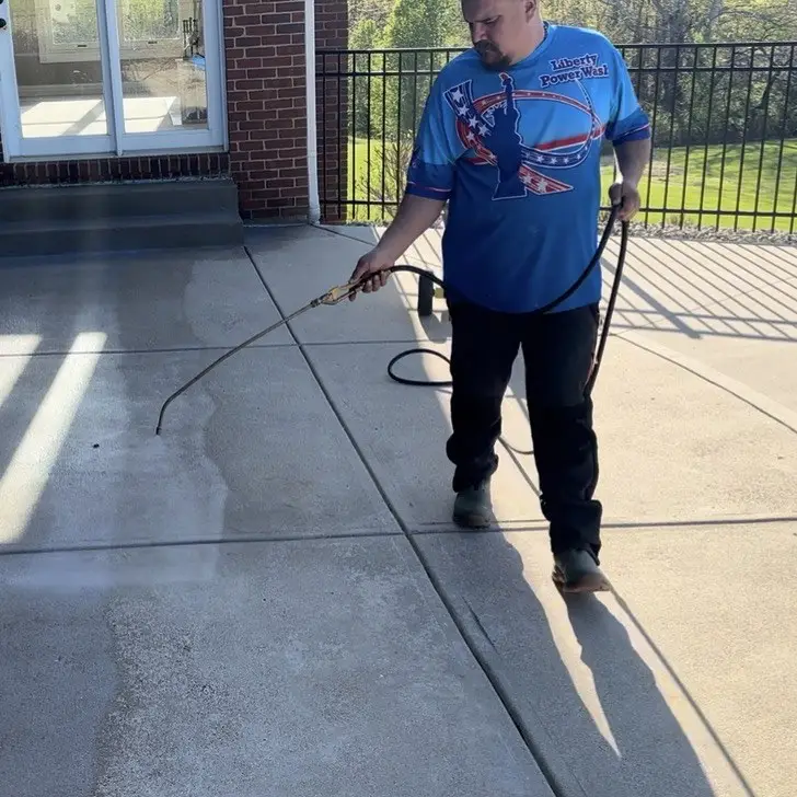 Concrete Sealing Applying concrete sealer to a patio in Hebron, KY