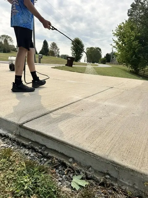 Concrete driveway cleaning treatment in Edgewood, KY
