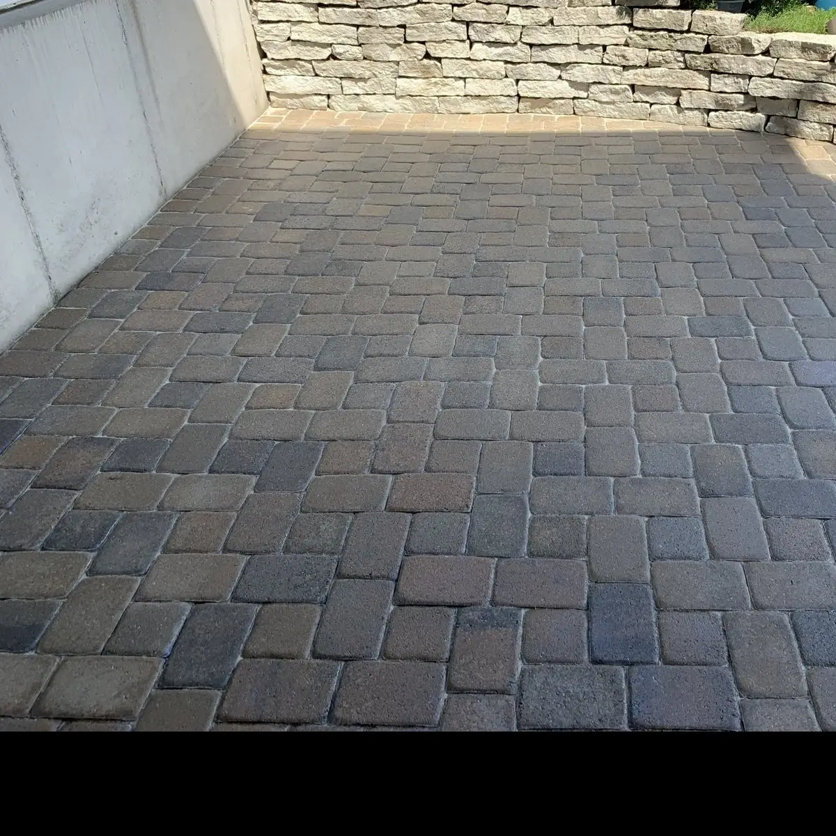 Paver Sealing Sealed paver patio with limestone retaining wall in Crestview Hills, KY