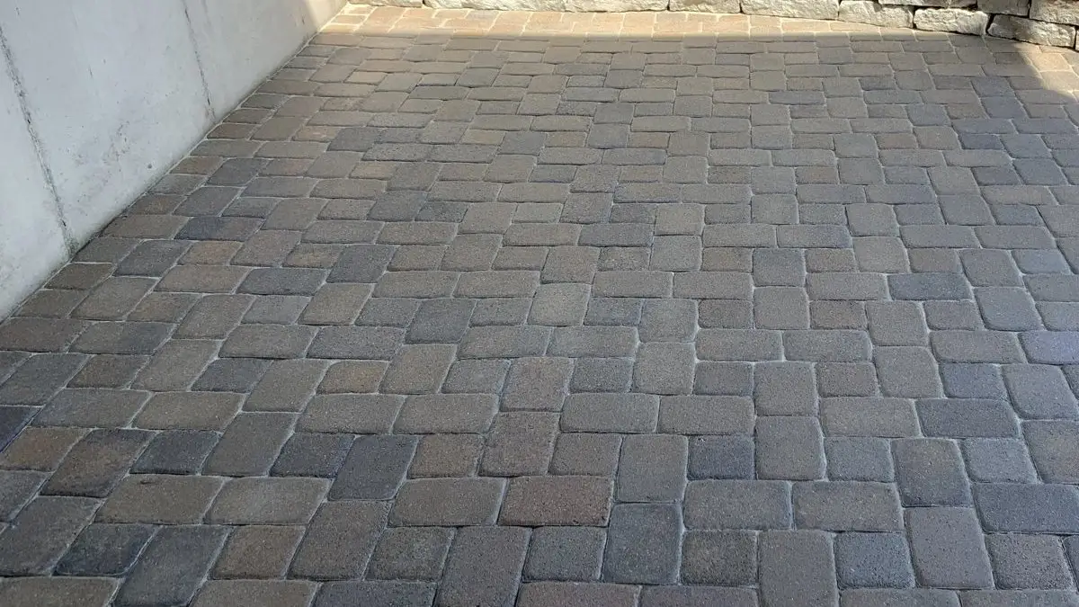 Sealed paver patio with limestone retaining wall in Newport, KY