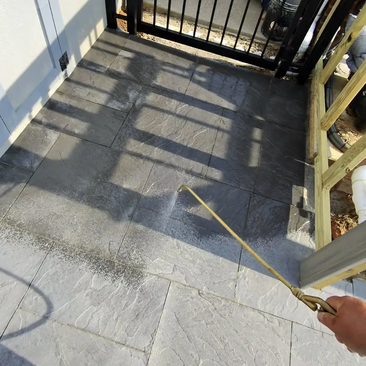 Concrete Sealing Applying penetrating sealer to a stamped concrete patio in Union, KY