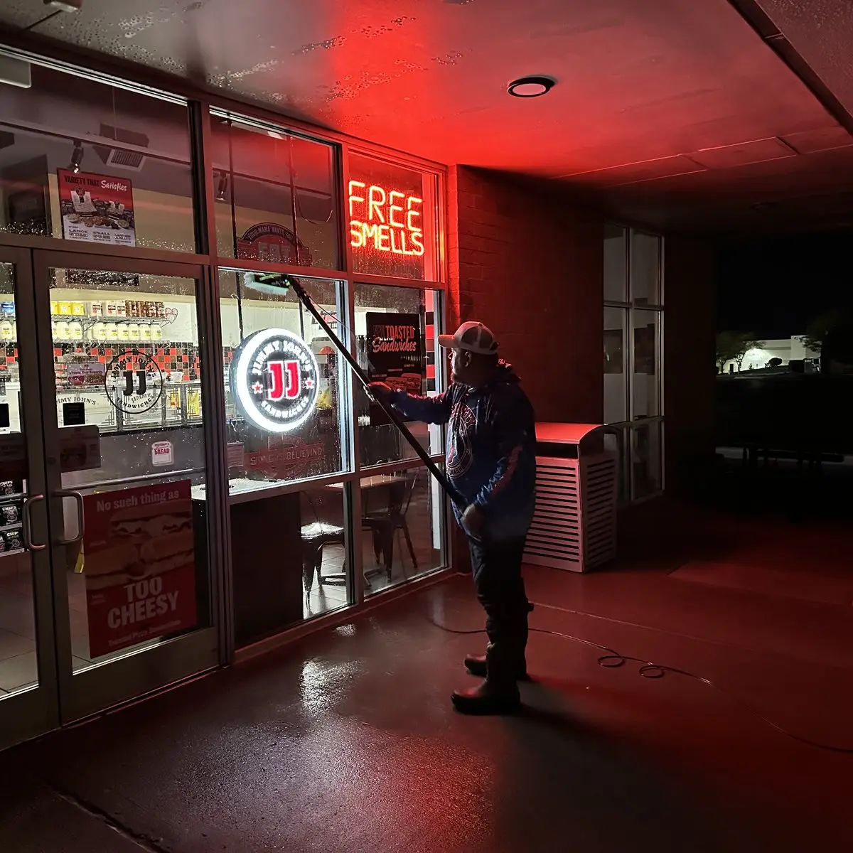 Commercial Pressure Washing Storefront window cleaning at night in Burlington, KY