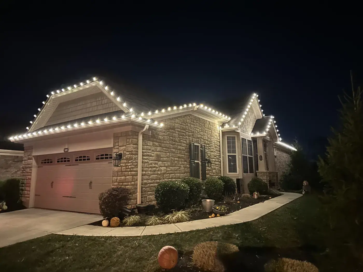 Christmas Light Installation in Blue Ash, OH Christmas roofline lights installed early in the season on a stone ranch home