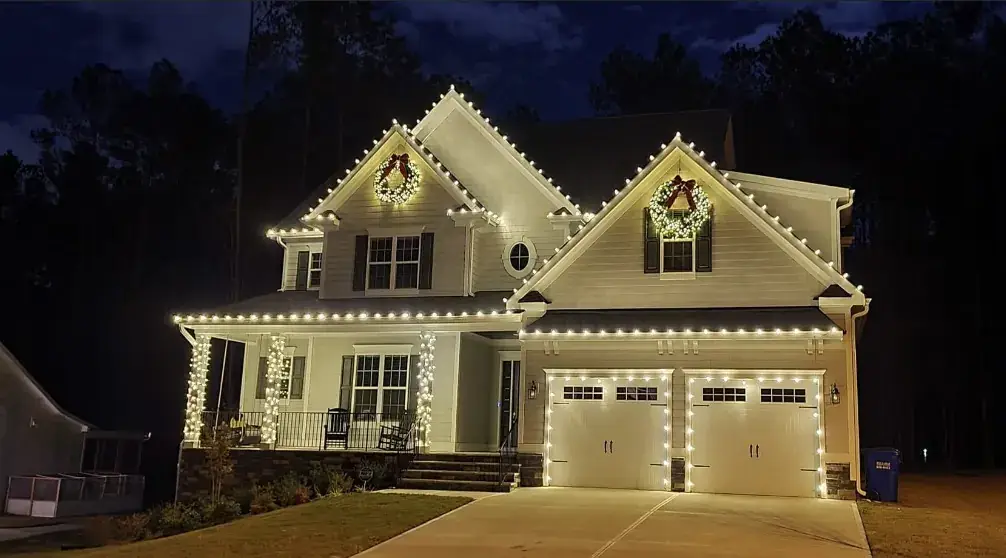 Christmas Light Installation in Indian Hill, OH Christmas lights outlining twin gables with wreaths in Indian Hill, OH