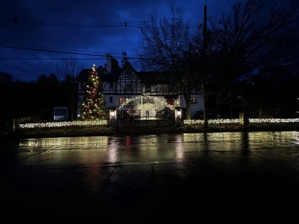 Christmas Lighting Estate Christmas lighting with a lighted fence line and Christmas tree