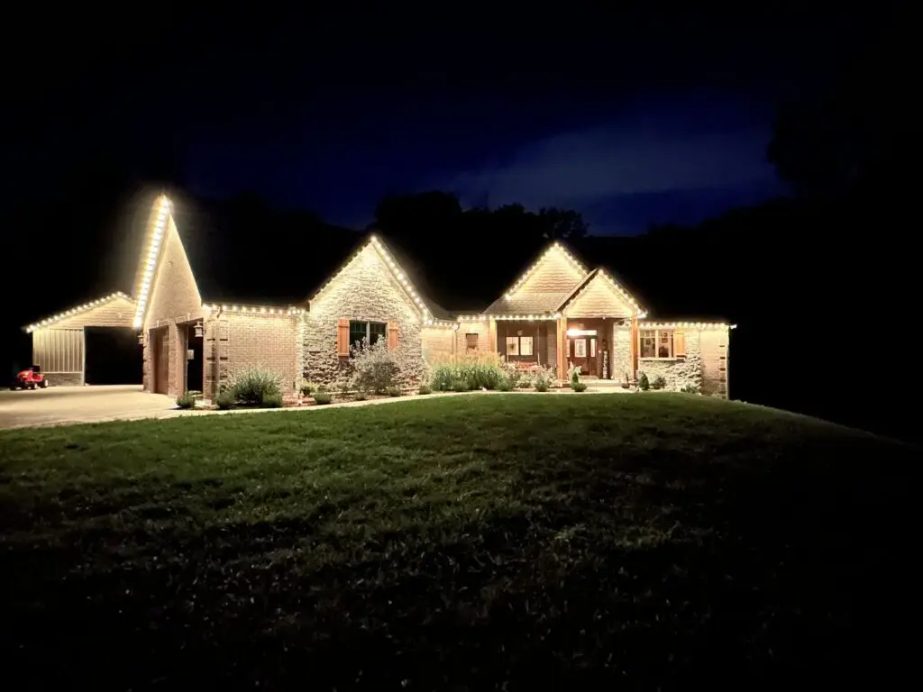 Christmas Lighting Permanent LED lighting set to classic warm white along the roofline