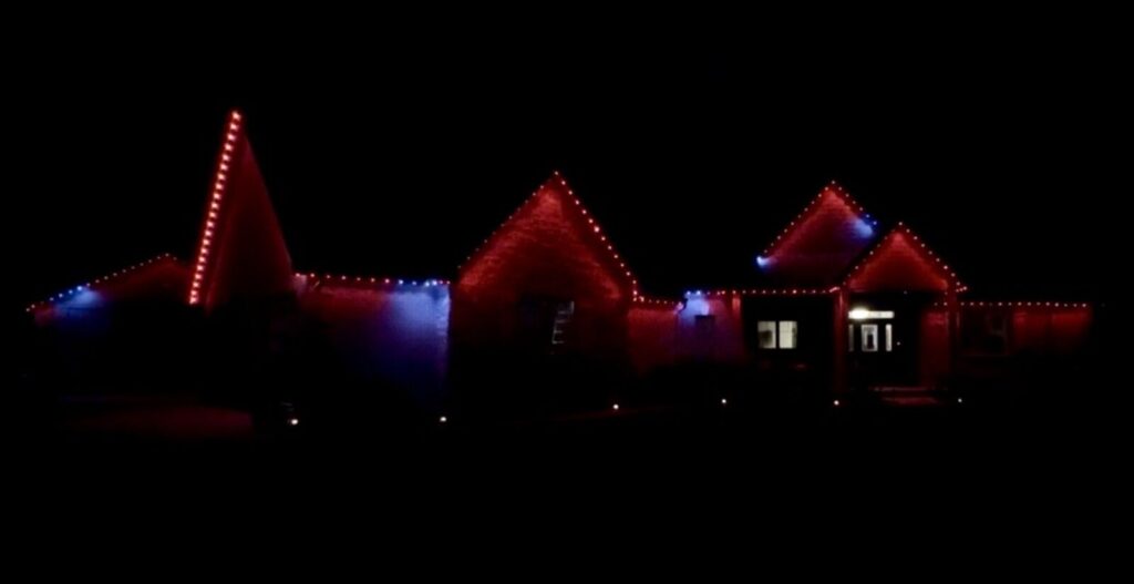 Christmas Lighting Permanent LED lighting running a red and blue moving pattern on a home in Hebron, KY