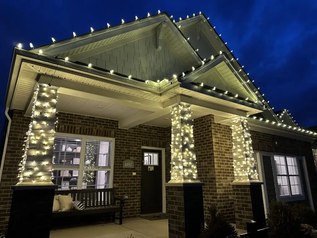 Christmas Lighting Front porch columns wrapped in warm white Christmas lights