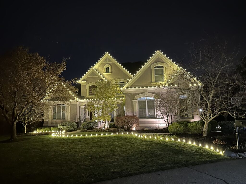 Christmas Lighting Warm white roofline Christmas lights with lighted walkway and lawn stakes in Indian Hill, OH