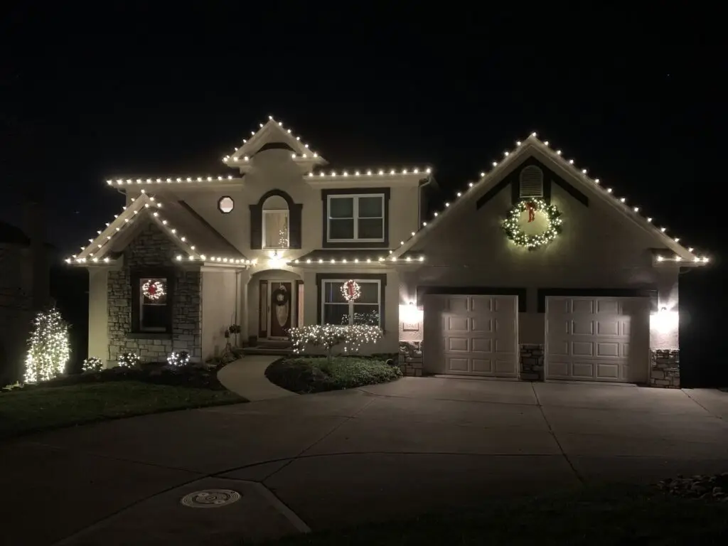 Christmas Lighting Warm white roofline Christmas lights with a lighted wreath